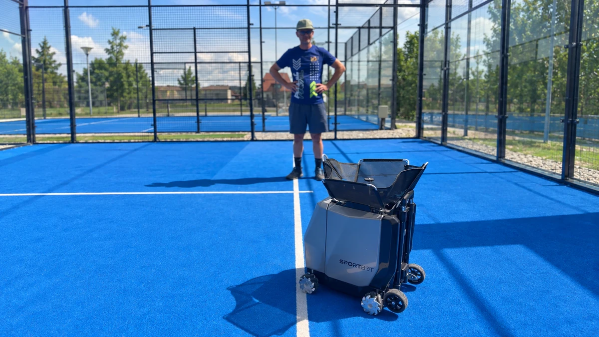A person behind Sportbot on the padel court at Transylvanian