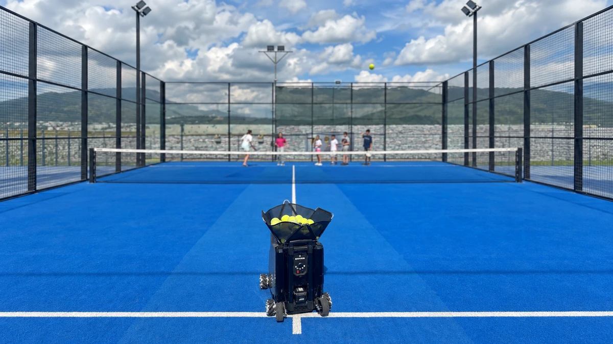 Sportbot with children practising across the net at Transylvanian
